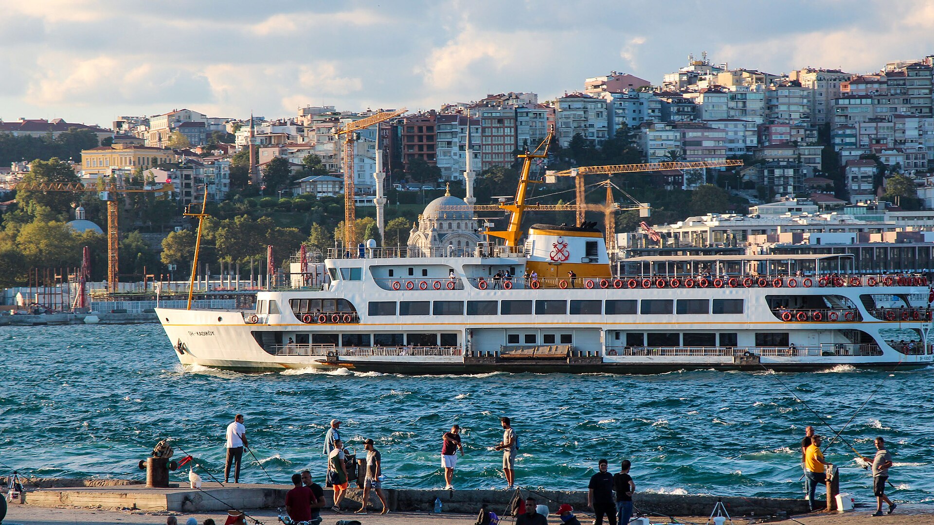 View of Cihangir neighborhood in Istanbul with the ferry boat going down the Bosphorus
