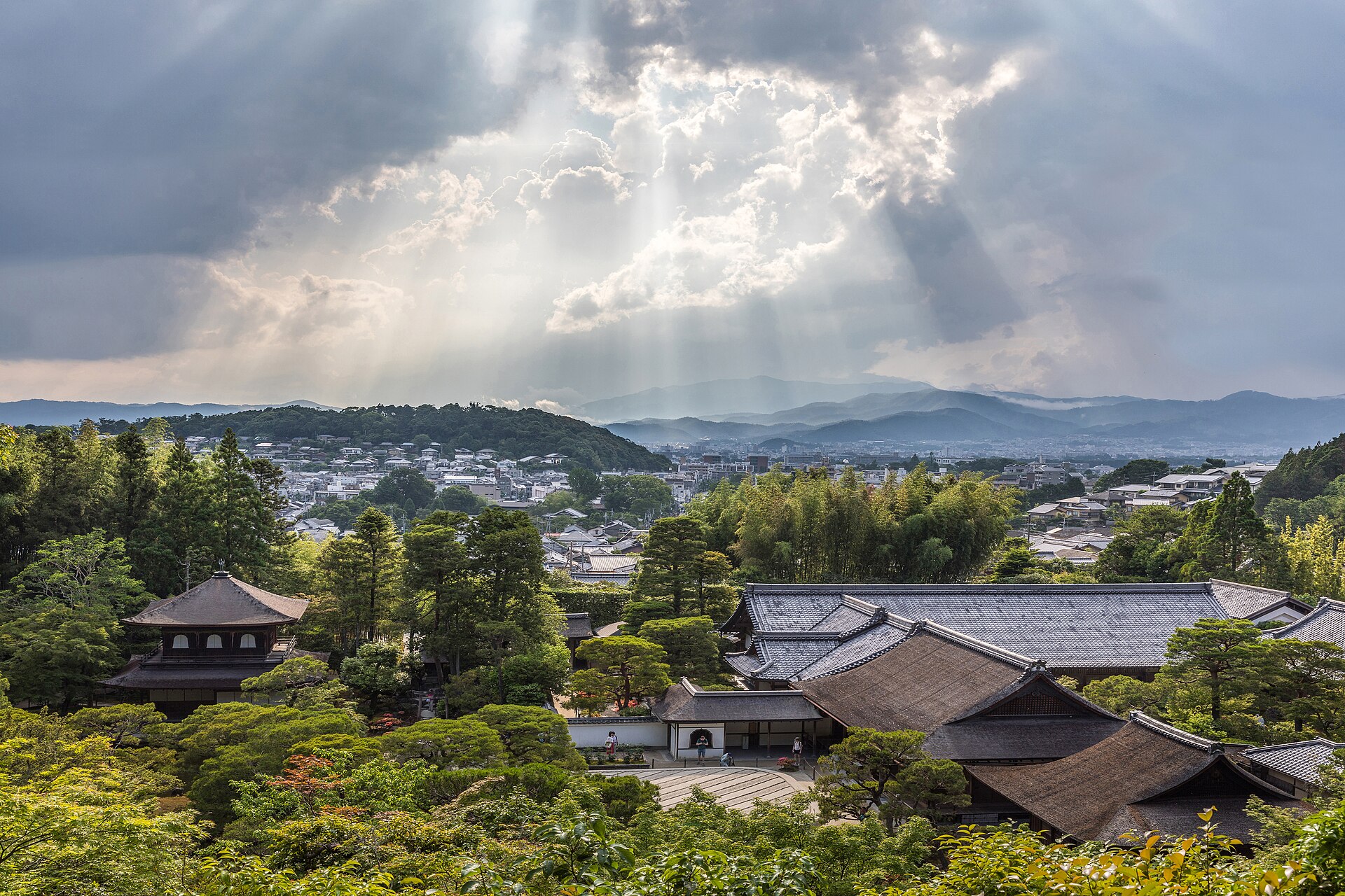Sunlight through clouds and lookout view of Ginkaku-ji (Temple of the Silver Pavilion) and Tōgudō from above, Kyoto, Japan.